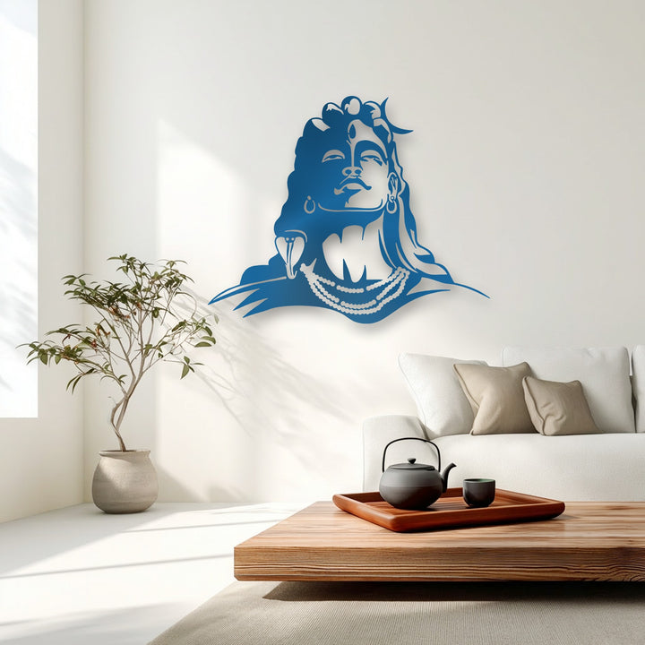 The bright white wall brilliantly illuminates the striking blue Lord Shiva metal artwork, highlighting its spiritual deity silhouette.