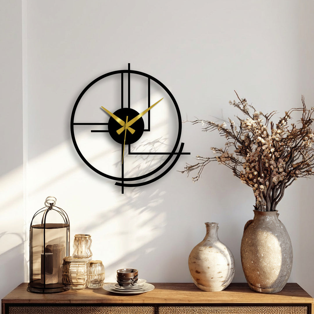 Smooth surface texture highlights the abstract lines of the modern circular metal art for wall clock, with contrasting matte and reflective sheens.