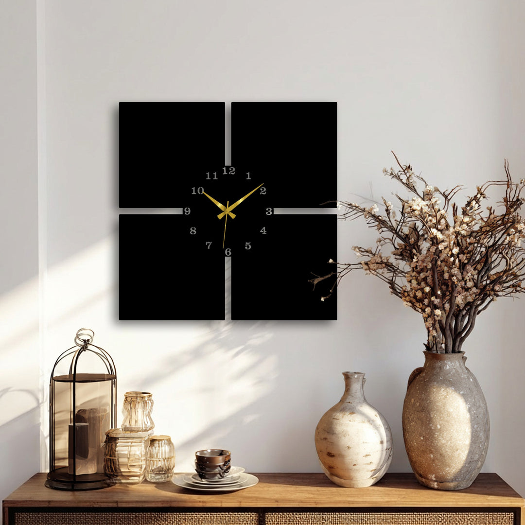 The superior material quality of this minimal panel metal wall clock is evident in its sleek, four-piece decorative metal art design with gold hands.