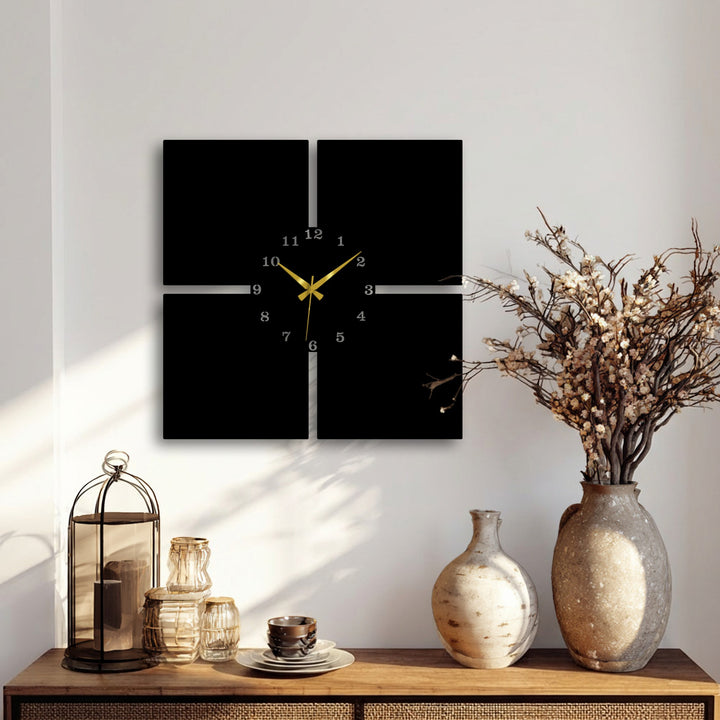 The superior material quality of this minimal panel metal wall clock is evident in its sleek, four-piece decorative metal art design with gold hands.