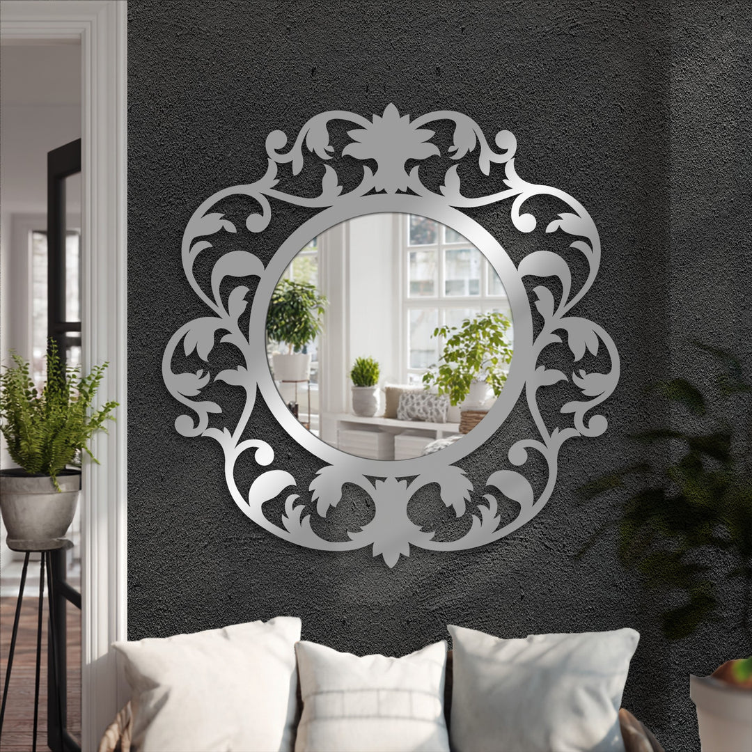 Circular mirror with vintage floral frame
