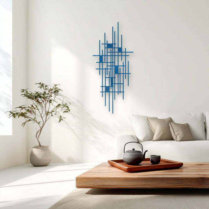 The central subject, an azure abstract geometric grid, forms a striking decorative metal art piece on the white wall.