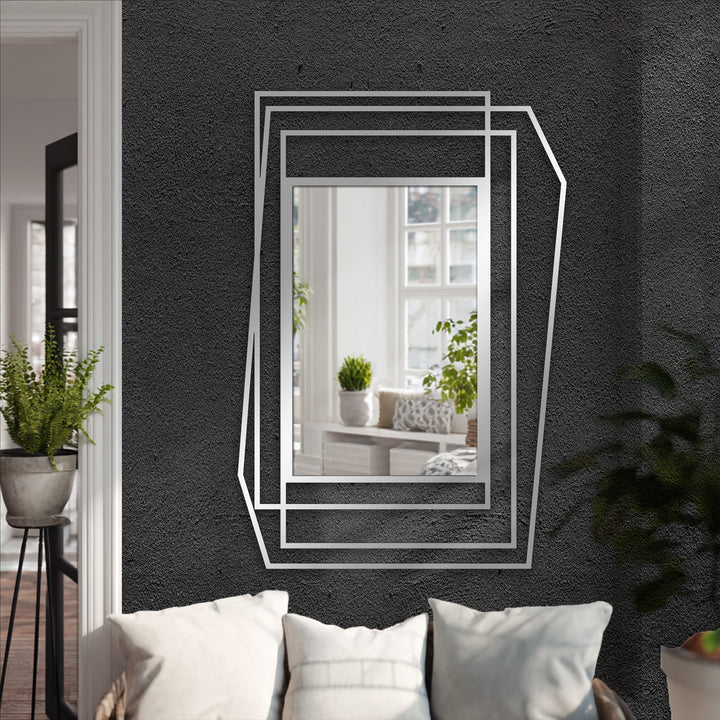 Reflecting a serene and contemporary mood, this layered geometric mirror for wall decor adds depth and modern elegance with its asymmetrical metal design.