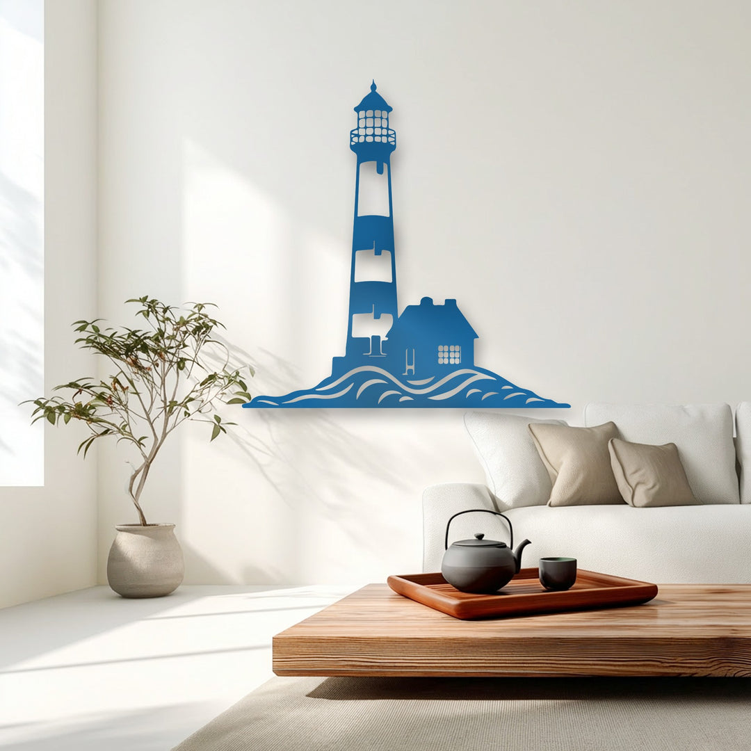 Bright, sun-warmed lighting highlights the elegant cerulean Coastal Lighthouse Silhouette decorative metal art against the luminous white wall.