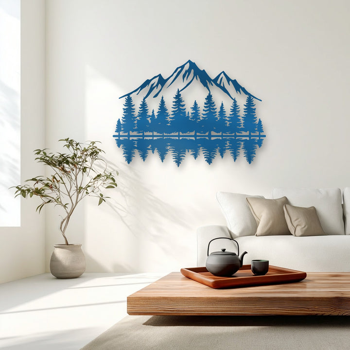 The stillness of the deep blue decorative metal art depicts a mountain forest reflection, creating a serene focal point in the minimalist room.