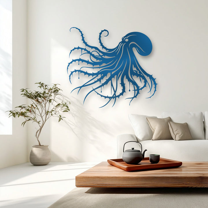 The brightest area features a pristine white wall showcasing intricate dark octopus metal artwork, casting dramatic shadows for a striking gothic ocean decor.