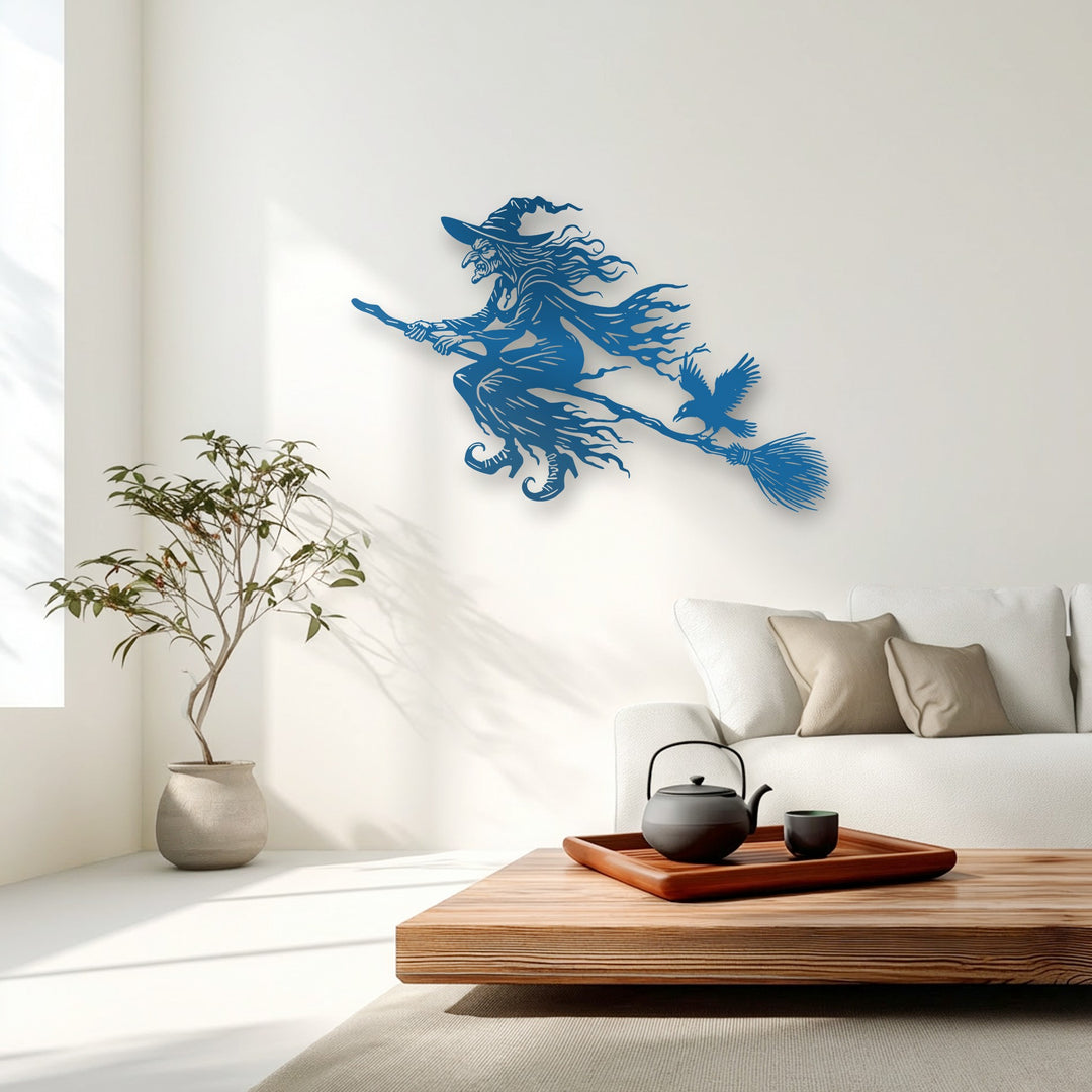 The sleek, smooth surface of the flying witch metal wall decor features a crisp, uniform texture against the matte wall.