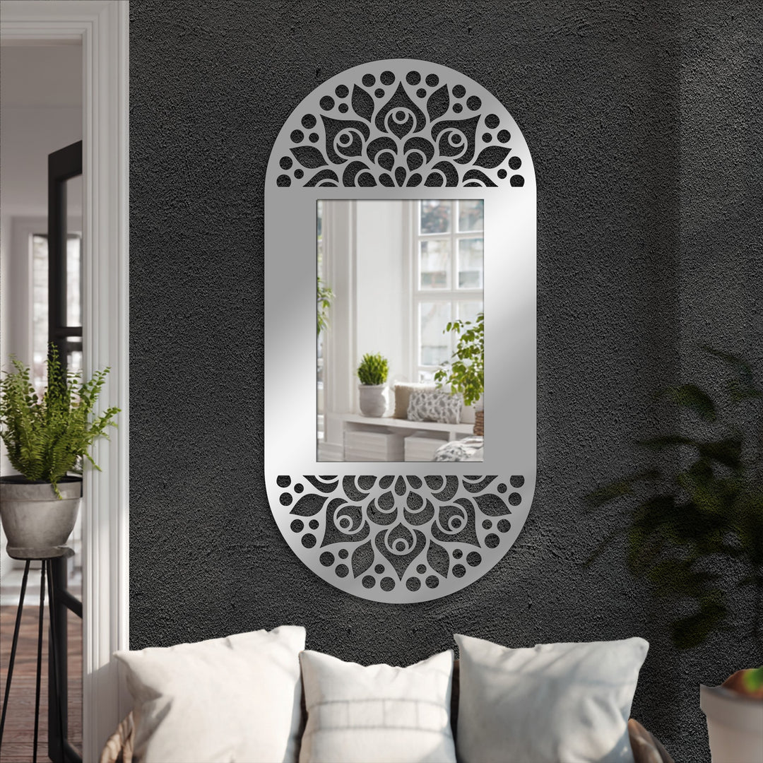 Organic, teardrop forms and circles compose the mandala-inspired, cutout frame of this unique metal wall art, an oval floor mirror with a modern, decorative frame.