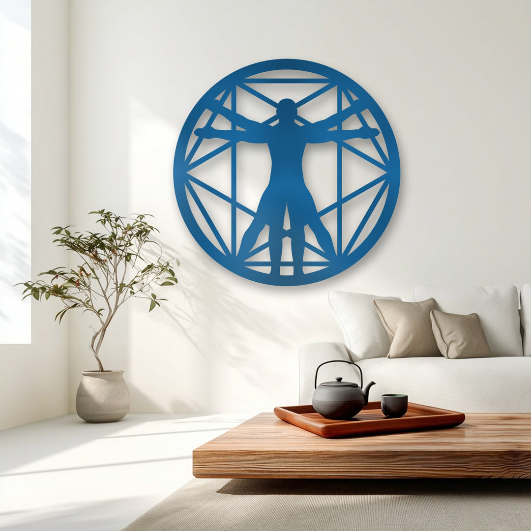 The layering effect is beautifully demonstrated by the vibrant blue Vitruvian Man geometric metal art for wall casting subtle shadows on the pristine white wall.
