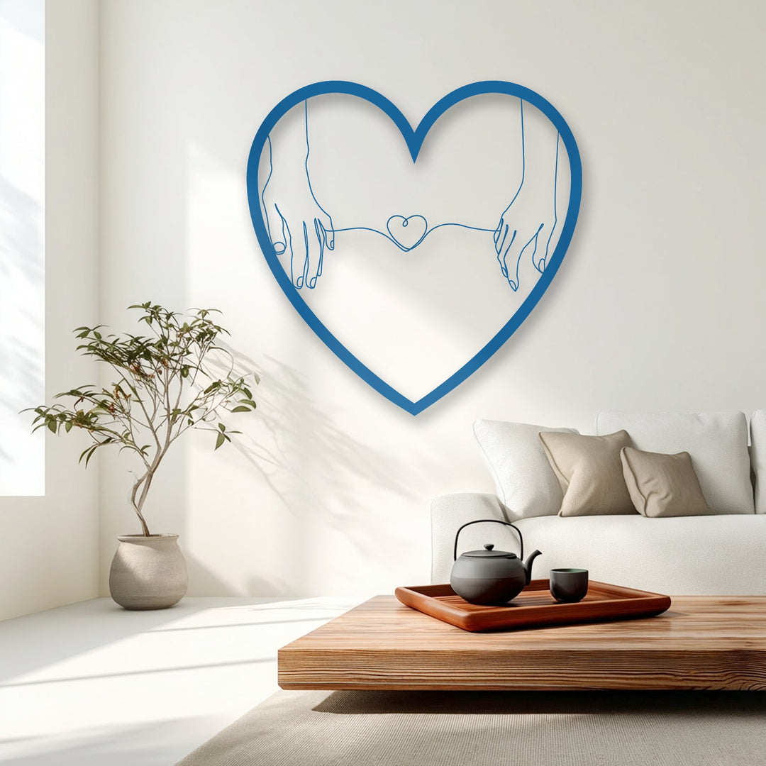 A bright white wall, illuminated by natural light and casting soft shadows, perfectly showcases the minimalist love metal wall decor.