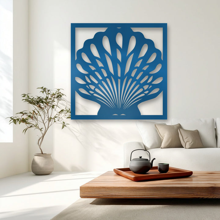 The striking transition between the deep azure metal art for wall and the crisp white wall accentuates the elegant seashell design.