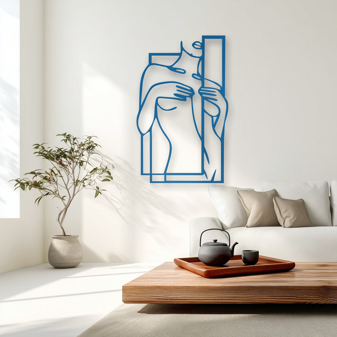 Stillness permeates this bright room, showcasing a bold blue minimalist female figure within a geometric frame, offering unique metal wall art.