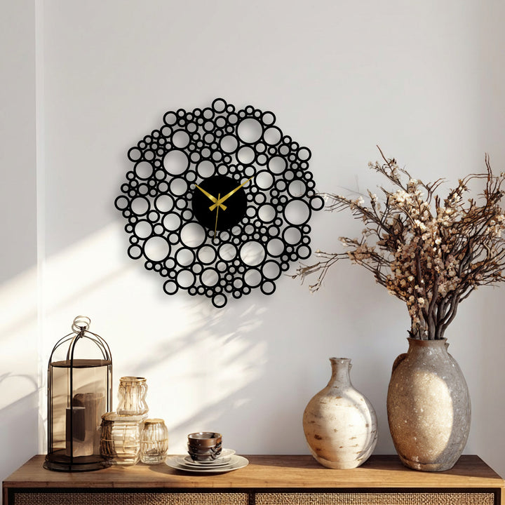 This bubble mesh metal wall clock, the central subject, showcases its unique metal wall art design through intricate circles, becoming a modern geometric focal point.