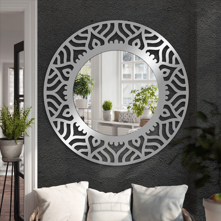 Abstract patterned black metal frame makes this modern wall mirrors a focal point, reflecting light and style in any contemporary space.