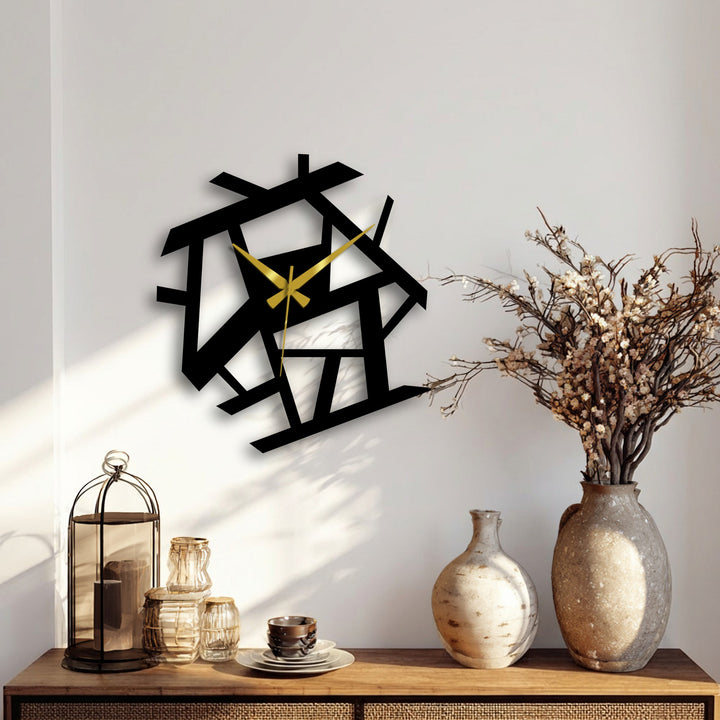 Showcasing geometric elements, this abstract metal artwork forms a striking wall clock with interlocking shapes and sleek, modern design.