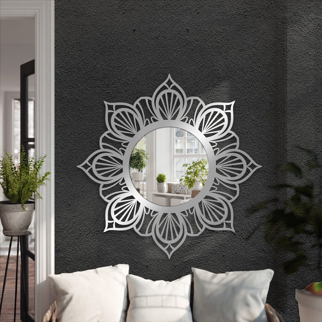 Centered is a decorative mirror featuring a mandala floral design in metal, creating unique metal wall art with an elegant symmetry for a stylish space.