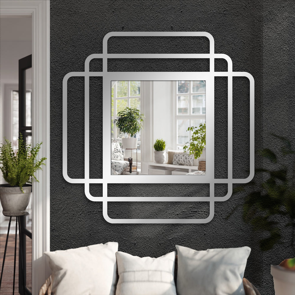 Stillness in the layered frames of the square, modern framed wall mirror, a decoration wall art piece reflecting a tranquil indoor scene.