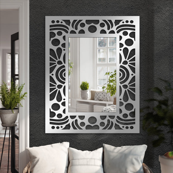 Highlighting the layering effect, the decorative Art Deco floor mirror's floral pattern and geometric metal frame showcase a stylish approach to decorating with wall mirrors.