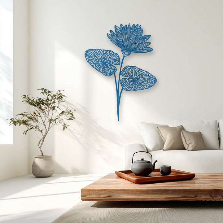 The matte finish of the azure lotus bloom and intricate leaves creates a striking decorative metal art piece on a bright wall.