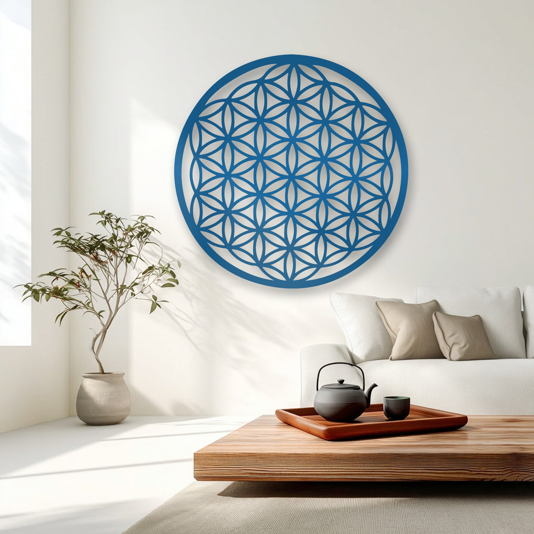 The visual rhythm of the intricate Flower of Life metal artwork in a serene azure circle design enhances the minimalist living space.