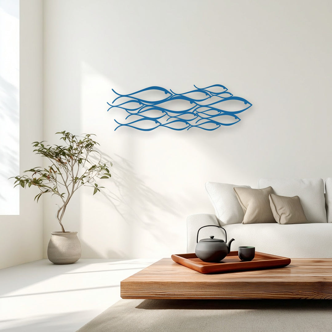 Abstract curvilinear fish shapes form a cohesive school, showcasing minimalist metal artwork against a stark white background.