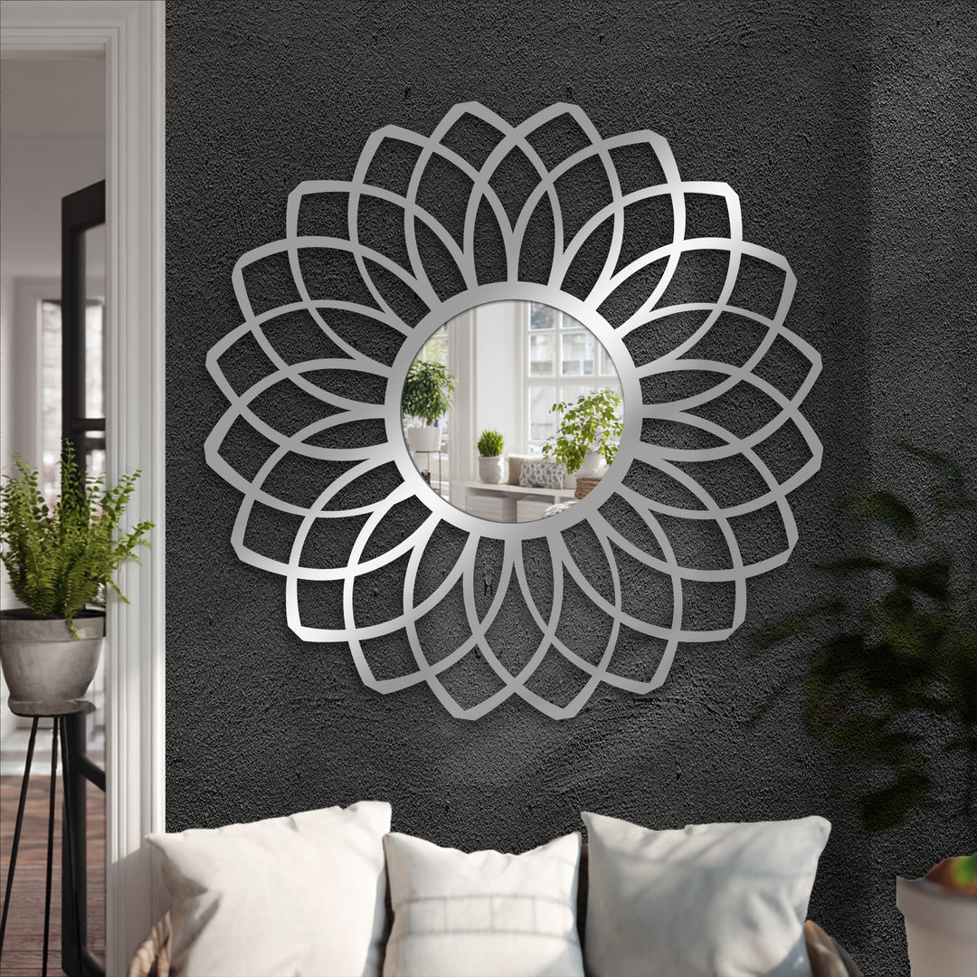 Stillness captures the decorative metal art in the layered petal floor mirror, reflecting a calm scene and adding depth to the quiet space.