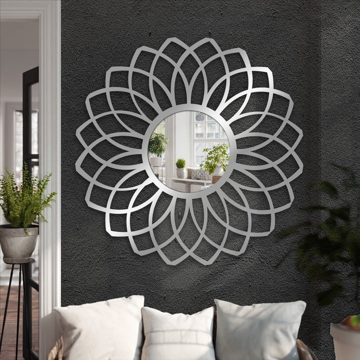 Stillness captures the decorative metal art in the layered petal floor mirror, reflecting a calm scene and adding depth to the quiet space.
