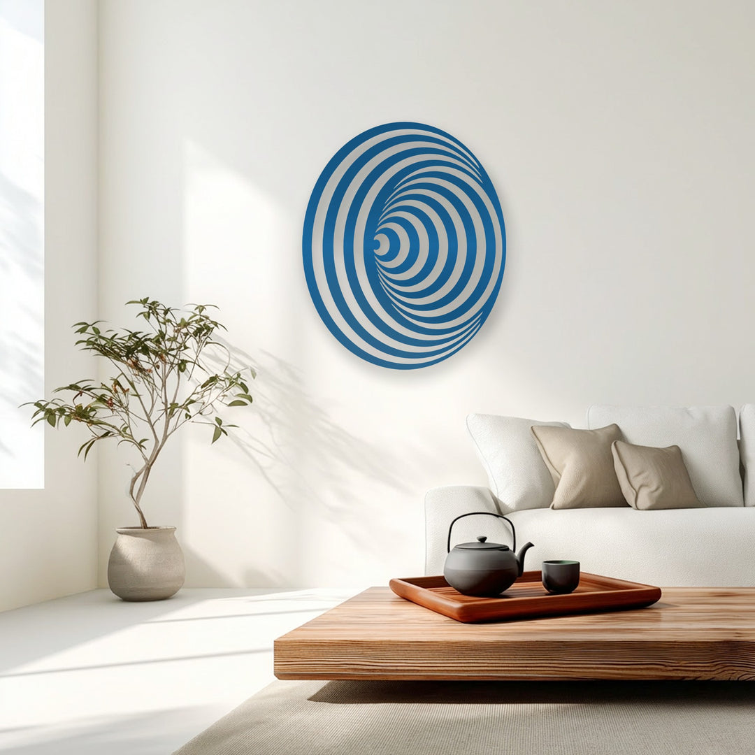 Cool-toned lighting illuminates the unique metal wall art with its vibrant blue and white hypnotic spiral circle, a modern geometric illusion.
