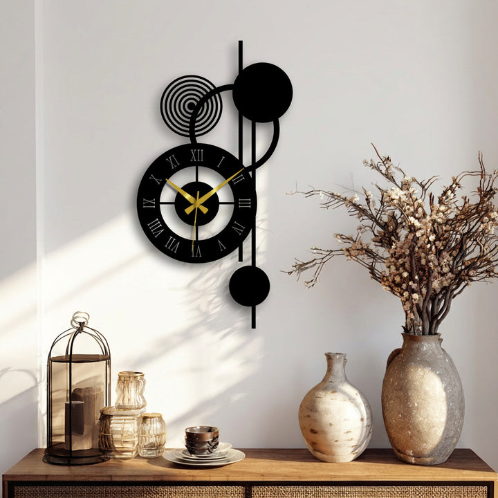 Background shows a cream-colored wall accentuating the modern orbit Roman metal wall clock, a sleek example of glass wall art decor, complemented by decorative vases on a wooden console.