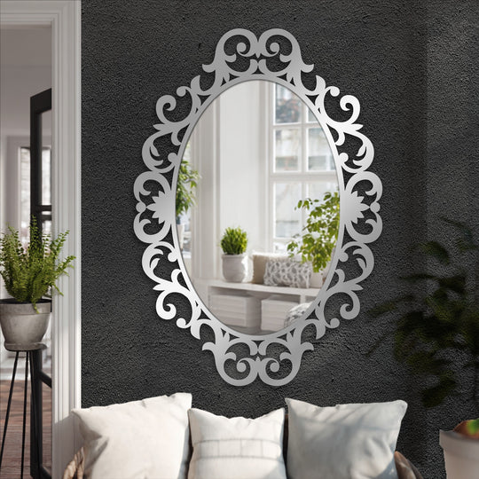 Delicate organic forms define this ornate scroll oval frame, reflecting a modern mirror that is a stunning decorative botanical wall decor.