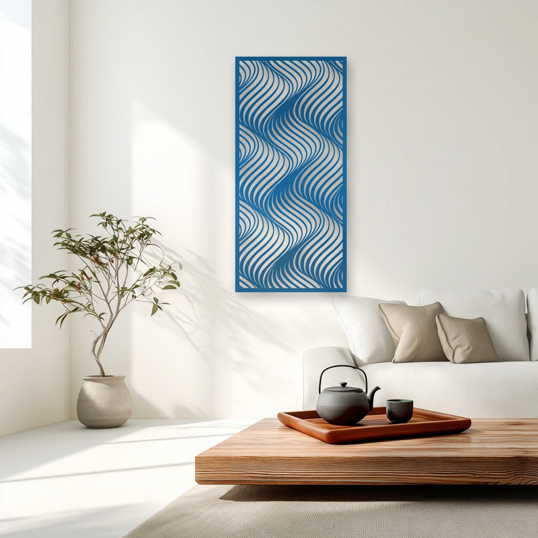 A vibrant blue metal decoration wall art panel featuring intricate flowing wave patterns is the central focus on a bright white wall.