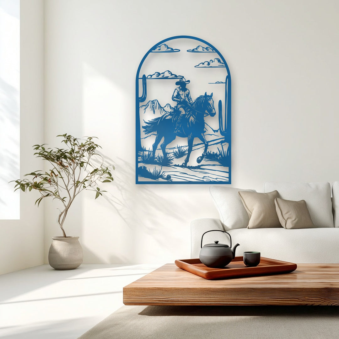 The cool color temperature of the bright white room accentuates the deep blue desert cowboy metal wall decor, creating a serene western scene.