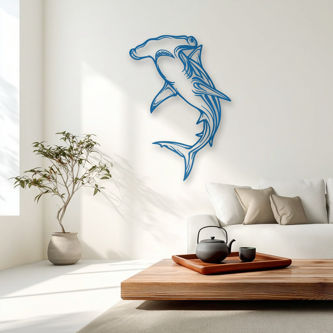 Surface texture of the unique metal wall art reveals smooth, precise cuts and subtle dimensionality in the blue hammerhead shark design.