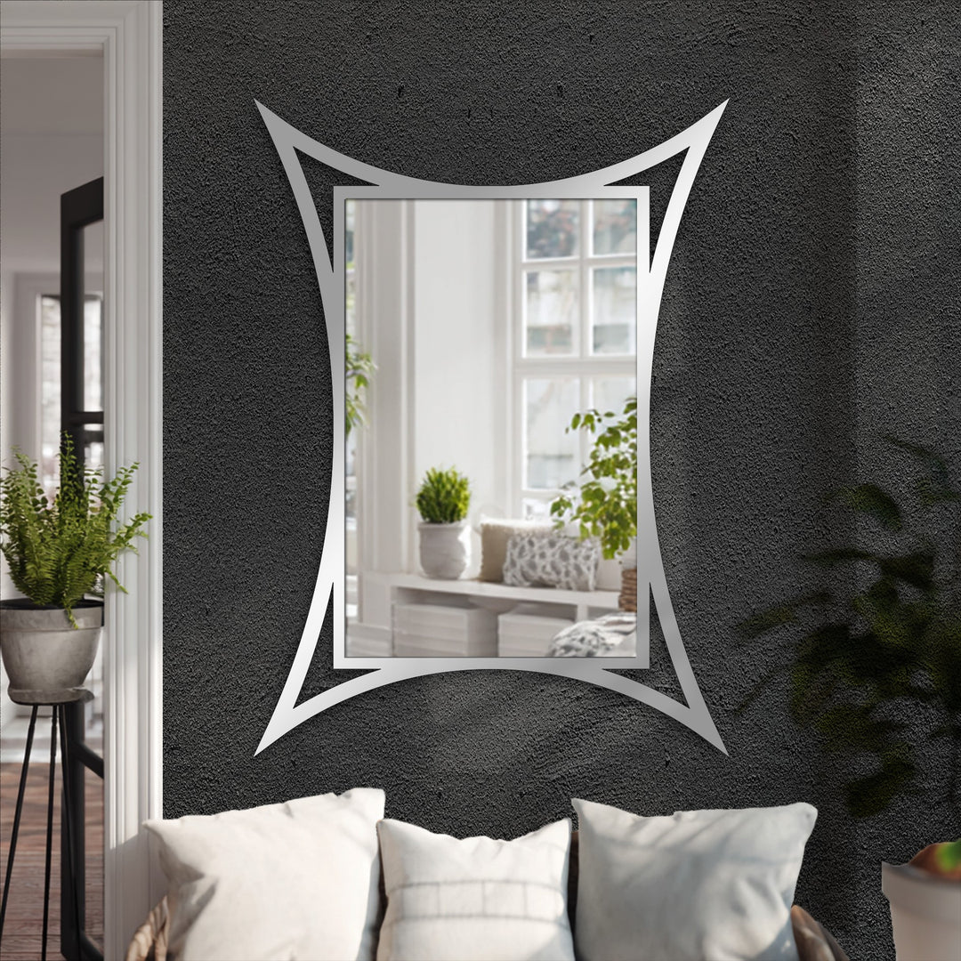 Reflecting depth and layers, the curved edge frame highlights the modern sculptural design of this stunning bathroom mirror, creating a captivating metal artwork.