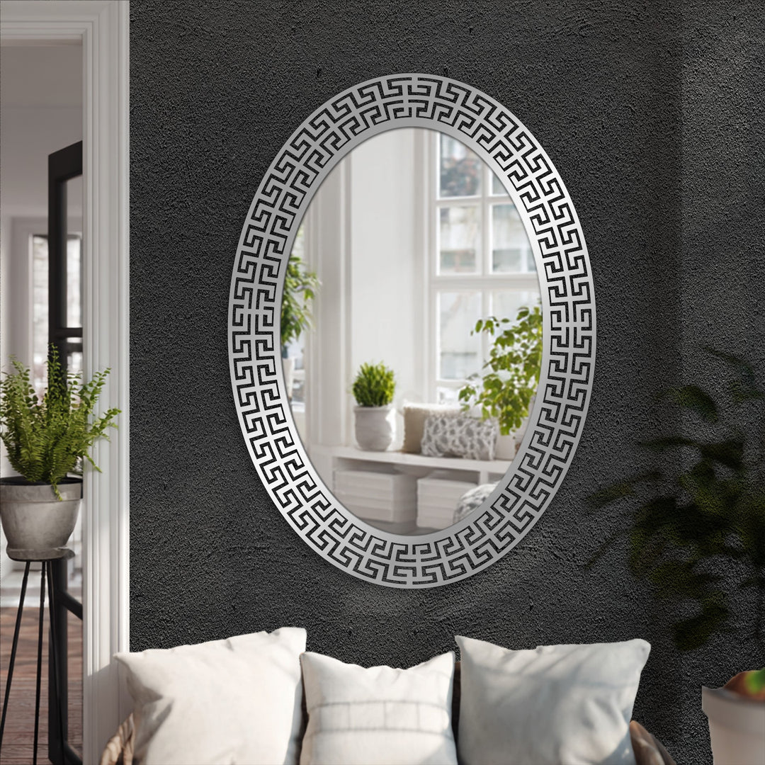 Central stylish oval floor mirror with Neo Greco patterned metal frame exemplifies decorating with wall mirrors for modern interiors.