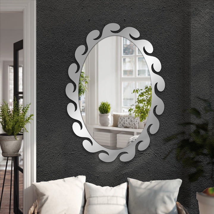 Vertically oriented, oval-shaped mirror showcasing the art of decorating with wall mirrors, featuring a unique fluid wave-sculpted frame.