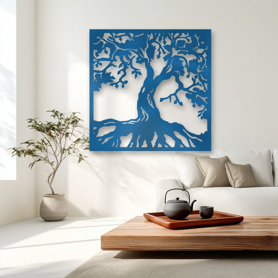 A wooden coffee table with a sleek black teapot and cup on a dark tray complements the unique metal wall art of a majestic tree silhouette.