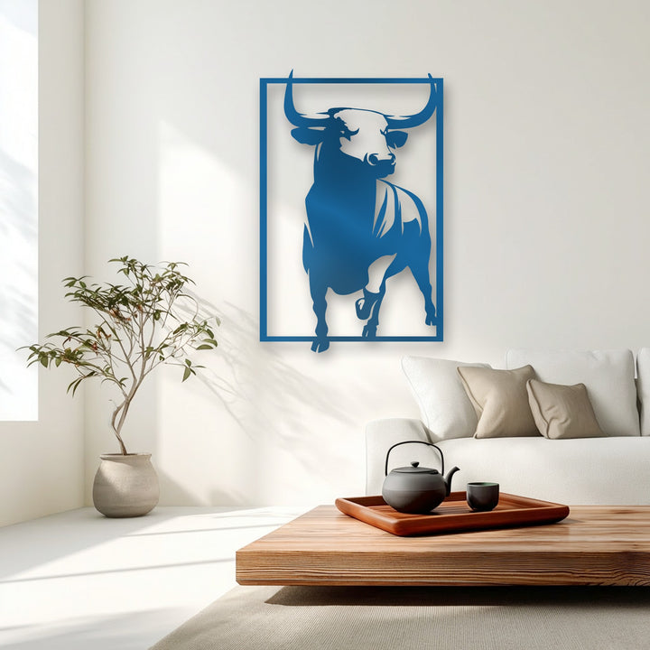 A vertical rectangular unique metal wall art features a powerful bull silhouette in bold blue, emphasizing its strong, striking shape.