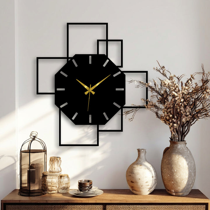 Warm color temperature highlights the black octagonal geometric metal wall clock with square frame as modern decoration wall art on a light wall.