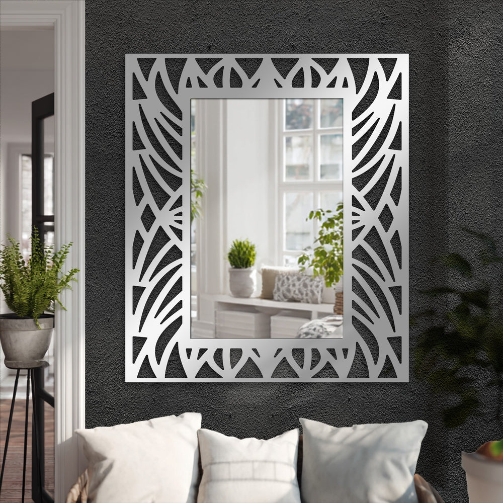Textured surface highlights the decorative cut-out frame of this abstract botanical pattern floor mirror, a striking example of modern wall mirrors design.