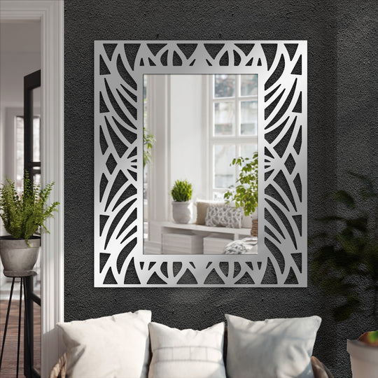 Textured surface highlights the decorative cut-out frame of this abstract botanical pattern floor mirror, a striking example of modern wall mirrors design.