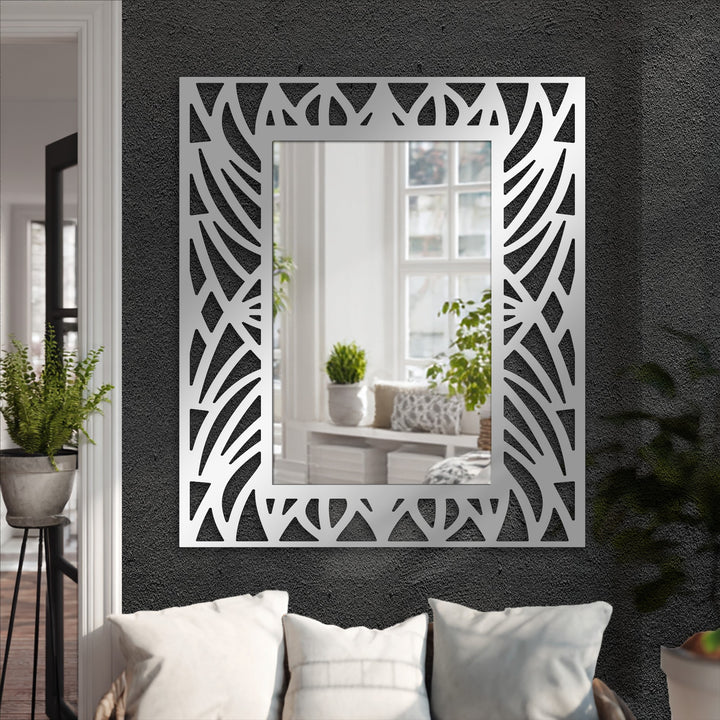 Textured surface highlights the decorative cut-out frame of this abstract botanical pattern floor mirror, a striking example of modern wall mirrors design.