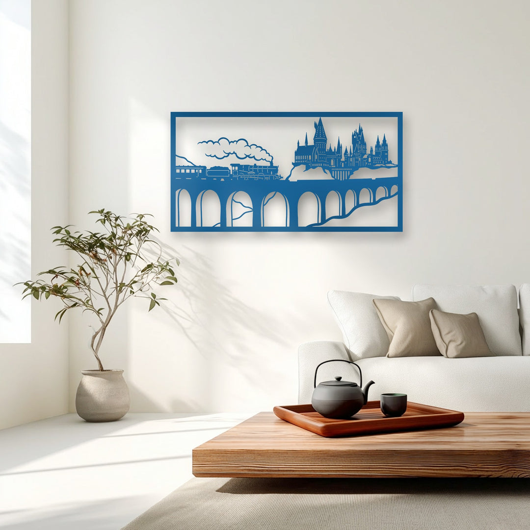 The focal point is a vibrant blue decorative metal art panel, showcasing an intricate wizard castle and a fantasy train scene.