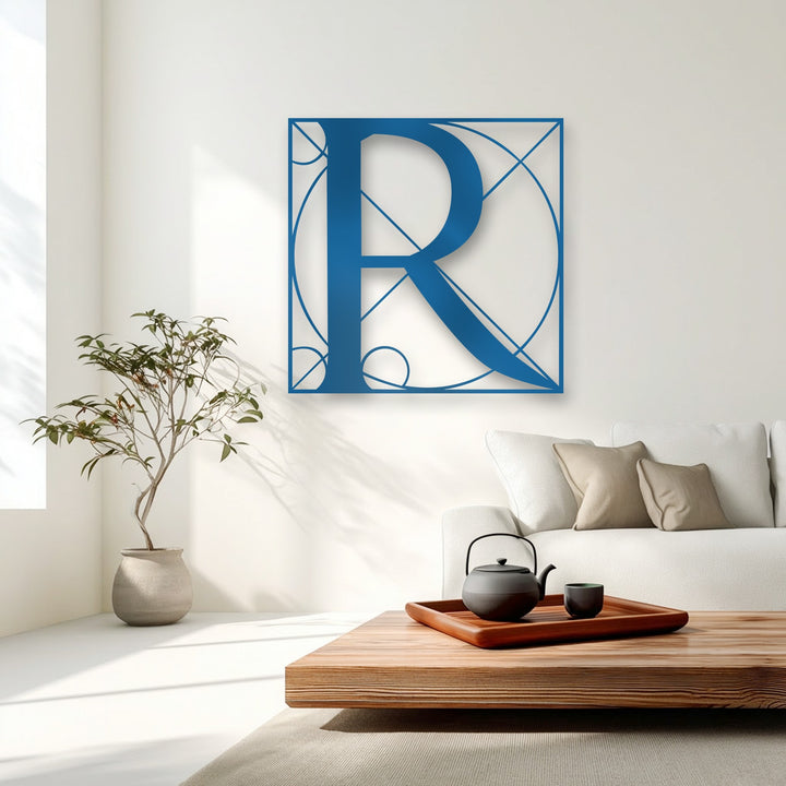 The crisp, azure blue borders of the Geometric Letter R metal art for wall form intricate lines and circles around the stylish monogram.