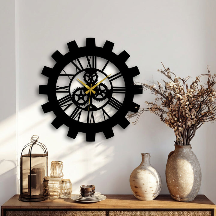 A rustic arrangement of decor pieces, including a glass-enclosed lantern, textured vases, and decorative wall art, accents the intricate, gear-shaped metal clock with gold hands.