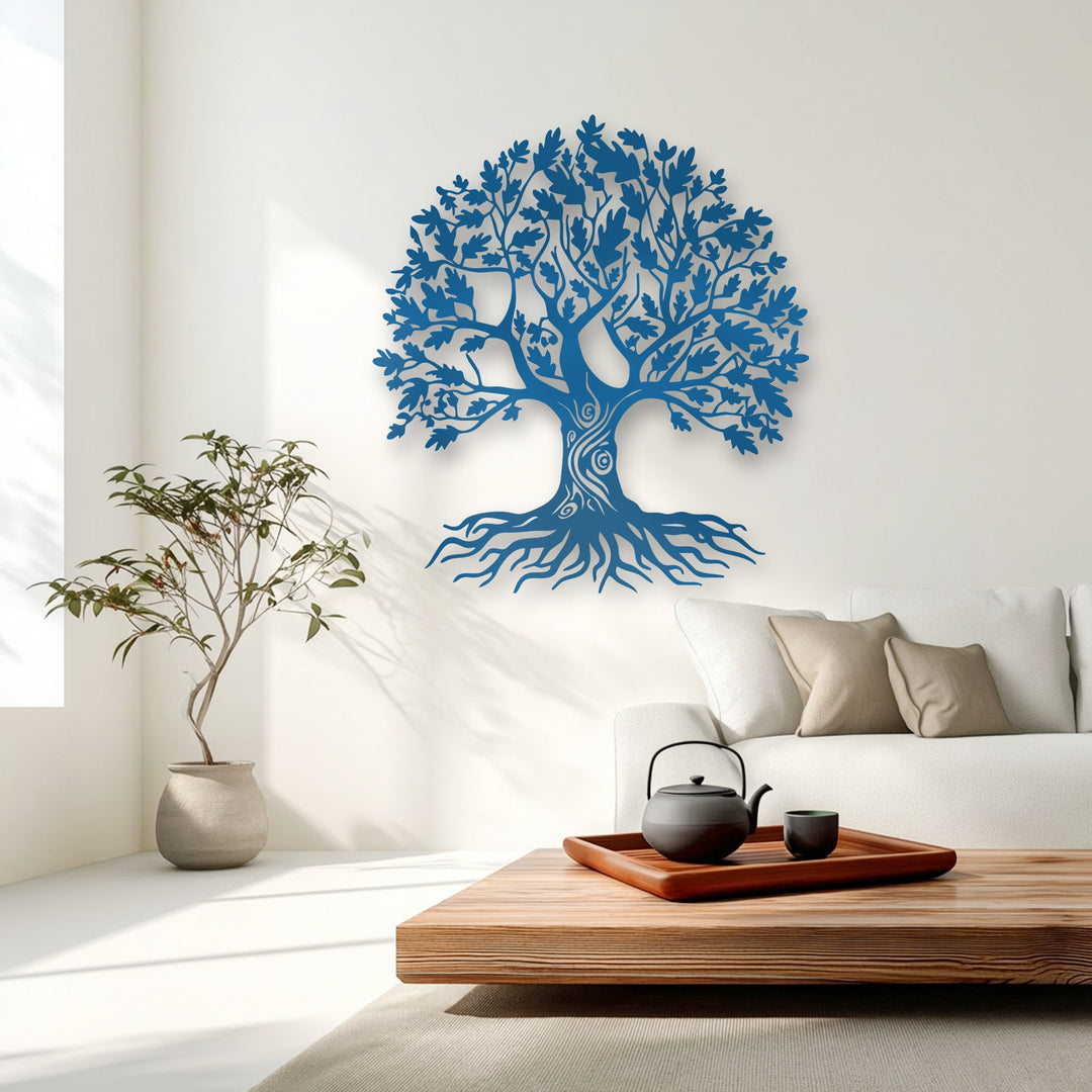 The vibrant blue ornate Tree of Life metal decoration wall art strikingly contrasts against the crisp white wall.