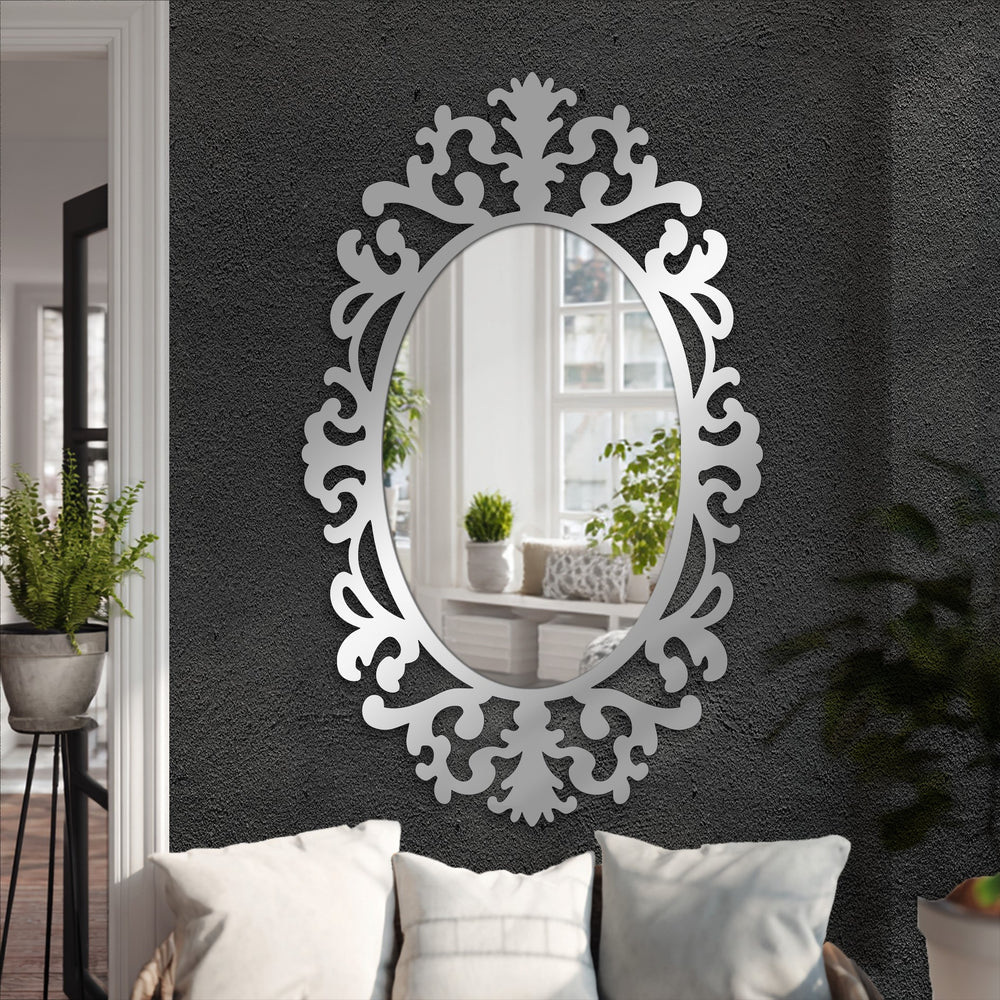 Calmly reflecting a peaceful room, this stained glass wall mirror with its ornate baroque-style frame, establishes a luxurious and artistic mood in the space.