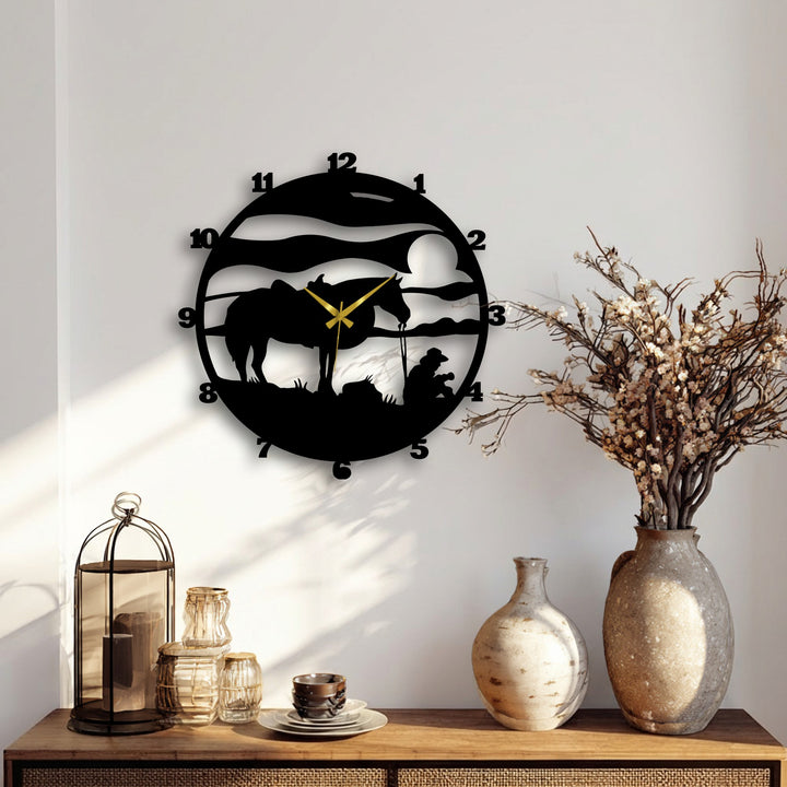 Negative space defines this metal wall decor clock, with its cowboy and horse silhouette creating a striking decorative wall art silhouette against the light wall.