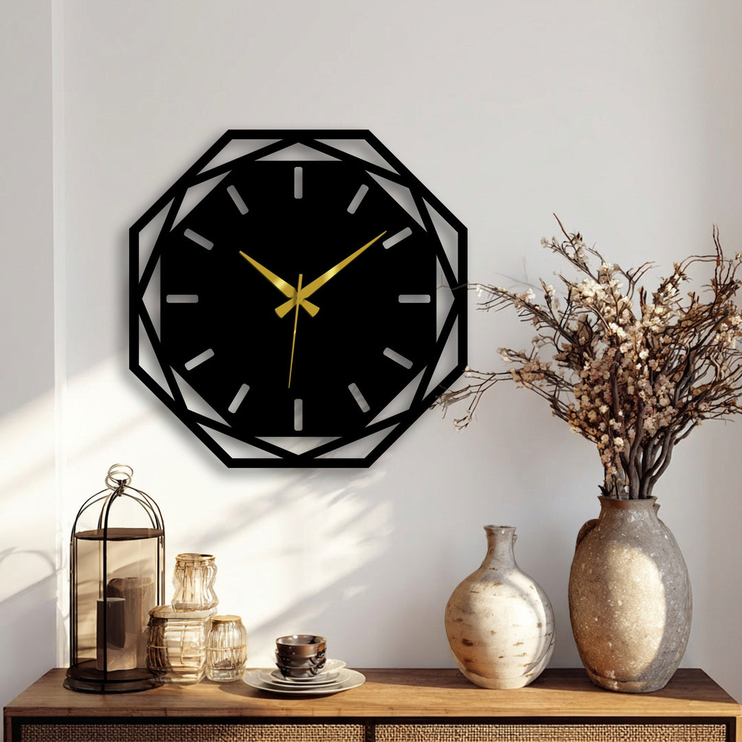 Illuminated by the brightest area, this modern metal wall clock presents a striking octagonal geometric design and exemplifies decorative metal art with its gold hands.