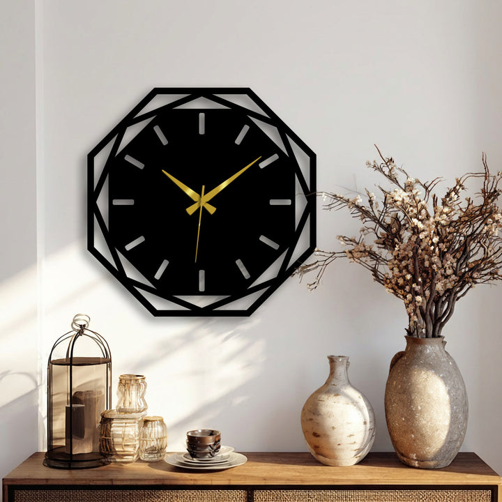 Illuminated by the brightest area, this modern metal wall clock presents a striking octagonal geometric design and exemplifies decorative metal art with its gold hands.